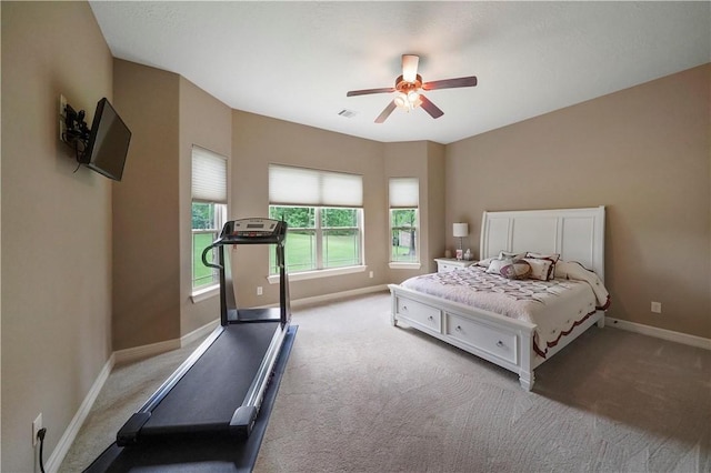 bedroom featuring light carpet and ceiling fan