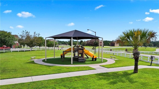 view of play area featuring a lawn and a gazebo