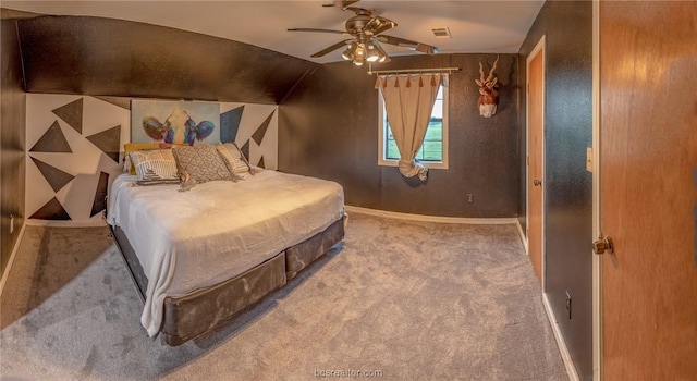 bedroom with ceiling fan, carpet, and vaulted ceiling