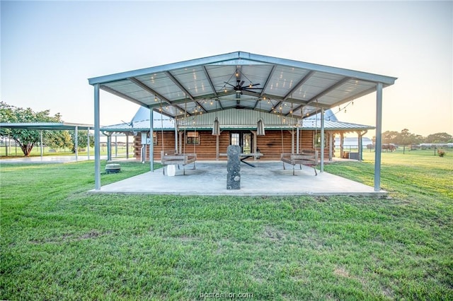 view of community with a lawn and a patio area