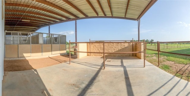 view of patio featuring an outbuilding