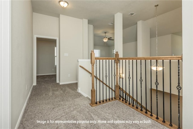 5638 Hayduke Ln, Bryan, TX 77845 - hall featuring an upstairs landing, carpet flooring, and baseboards