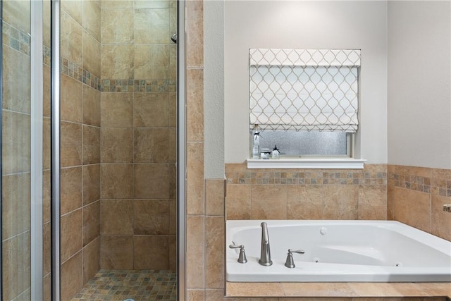 bathroom with shower with separate bathtub