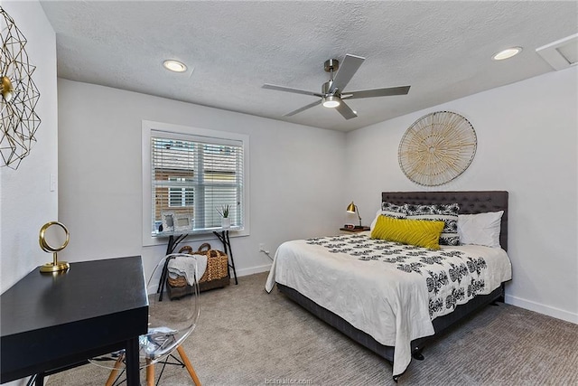 bedroom featuring ceiling fan, a textured ceiling, and carpet flooring