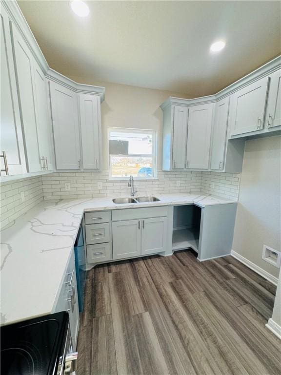 kitchen with sink, white cabinetry, range with electric stovetop, light stone countertops, and backsplash