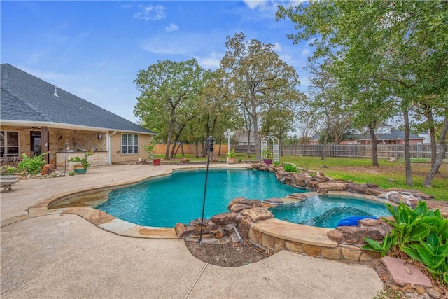 view of pool featuring a patio area and an in ground hot tub