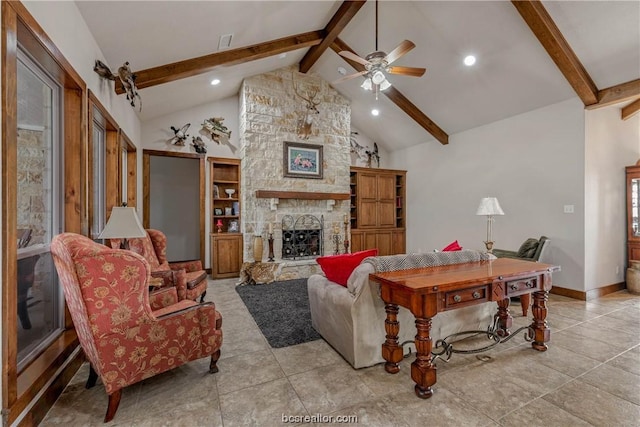 tiled living room with ceiling fan, beam ceiling, a stone fireplace, and high vaulted ceiling