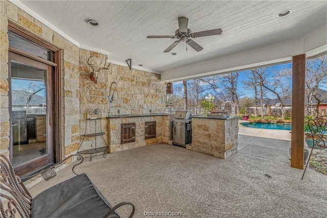 view of patio featuring an outdoor kitchen, ceiling fan, a fenced in pool, and a grill