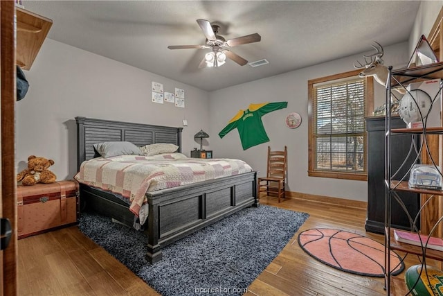 bedroom featuring ceiling fan and wood-type flooring