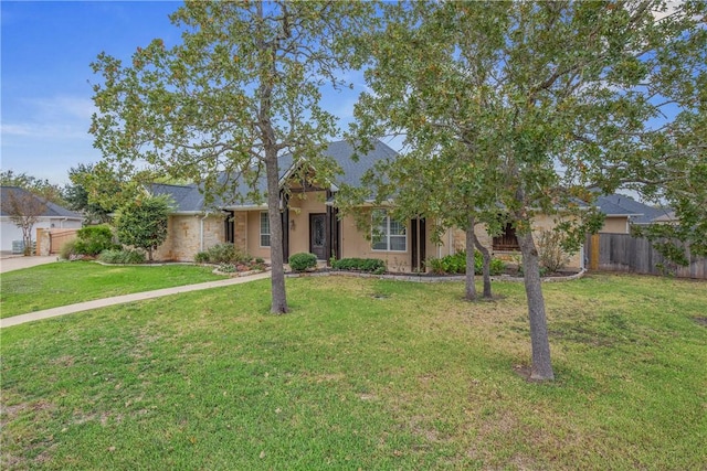 view of front of property with a front lawn and a garage