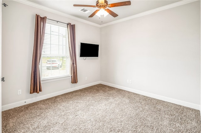 carpeted empty room with ceiling fan and crown molding