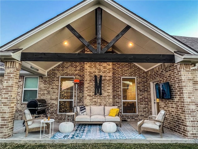 rear view of house with a patio and an outdoor hangout area