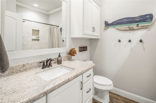 bathroom with toilet, walk in shower, hardwood / wood-style floors, ornamental molding, and vanity