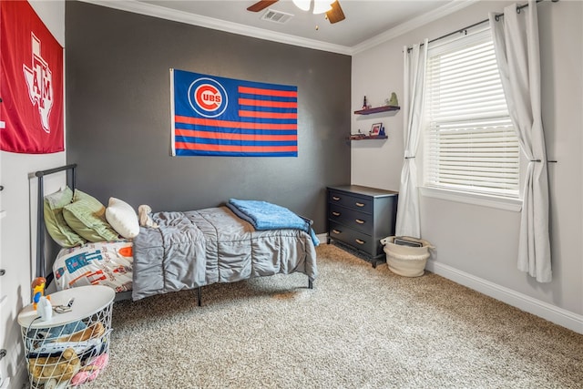 bedroom featuring carpet floors, crown molding, and ceiling fan