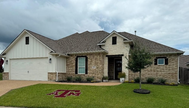 view of front of house featuring a front lawn and a garage