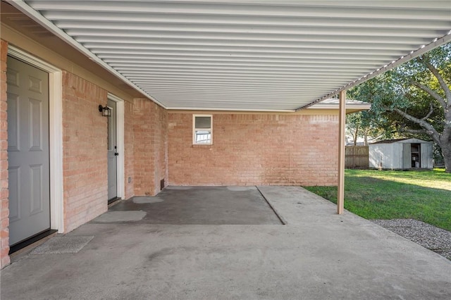 view of patio / terrace featuring a shed