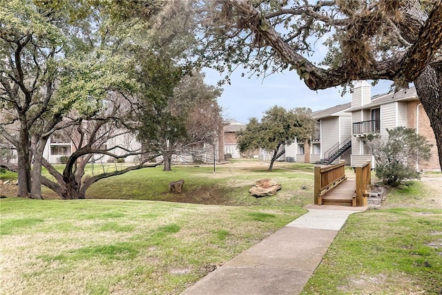 view of property's community with a yard