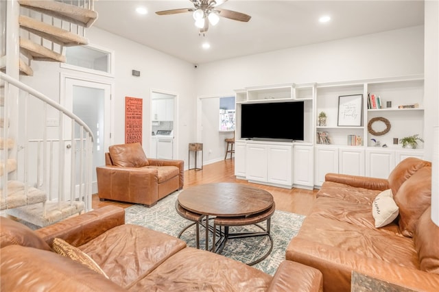 living area featuring recessed lighting, separate washer and dryer, light wood-style flooring, stairway, and a ceiling fan
