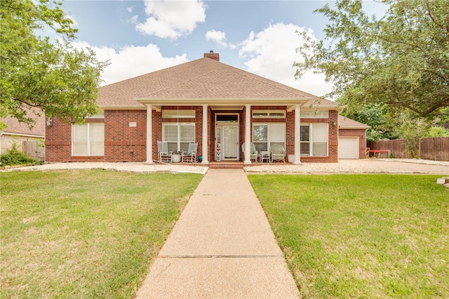 ranch-style house with fence, covered porch, a front yard, and brick siding