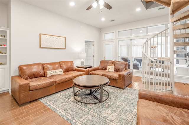 living area featuring recessed lighting, visible vents, ceiling fan, and light wood-style floors