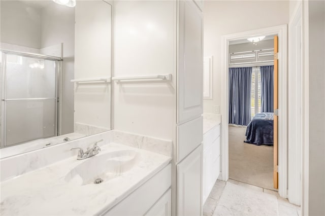 full bathroom featuring tile patterned floors, an enclosed shower, and vanity