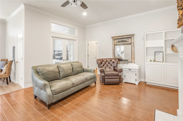 living area with crown molding, light wood-style flooring, ceiling fan, baseboards, and french doors