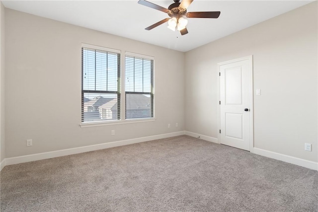 empty room featuring ceiling fan and carpet floors