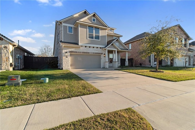 craftsman house featuring a front lawn and a garage