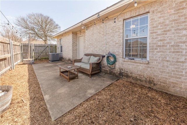 view of patio / terrace with an outdoor hangout area, central AC, and a fenced backyard