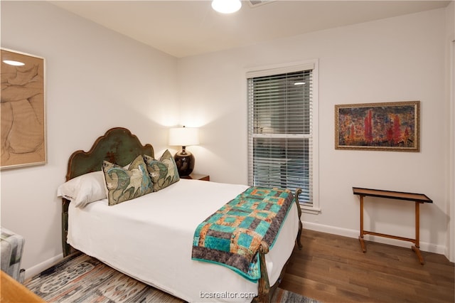 bedroom featuring dark hardwood / wood-style floors