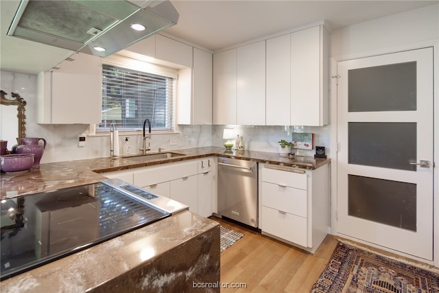 kitchen with sink, white cabinets, stove, stainless steel dishwasher, and light wood-type flooring