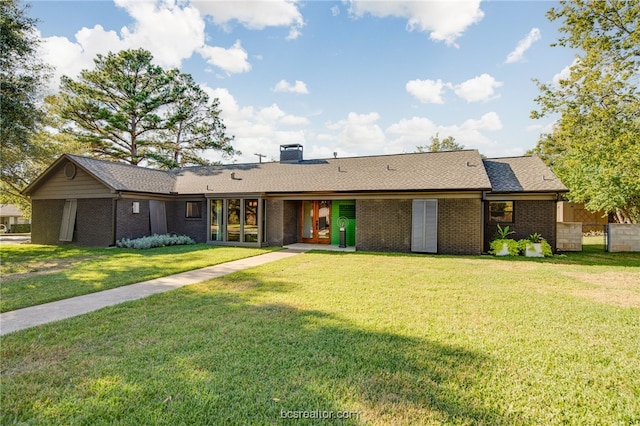 ranch-style home featuring a front yard