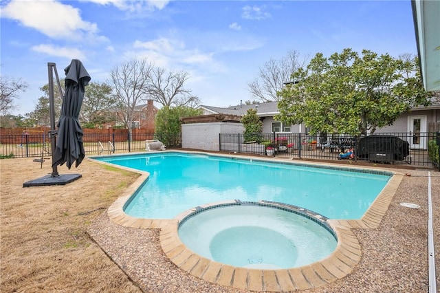 view of pool with an in ground hot tub