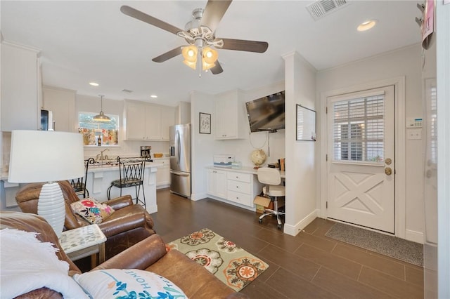 living room with ceiling fan