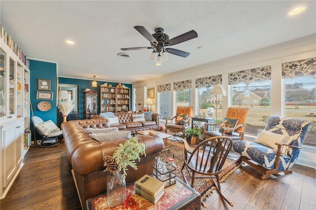 living room featuring ornamental molding, ceiling fan, and dark hardwood / wood-style flooring