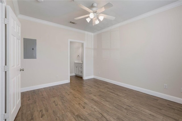 801 Luther St W Unit 307, College Station, TX 77840 - unfurnished bedroom featuring electric panel, wood finished floors, ornamental molding, and baseboards