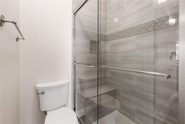 801 Luther St W Unit 307, College Station, TX 77840 - bathroom featuring toilet and a stall shower