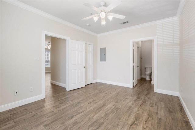 801 Luther St W Unit 307, College Station, TX 77840 - unfurnished bedroom with wood finished floors, ornamental molding, electric panel, baseboards, and ceiling fan
