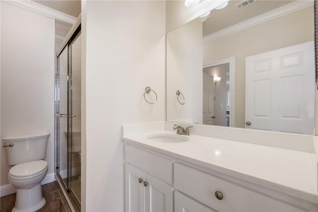 801 Luther St W Unit 307, College Station, TX 77840 - full bathroom with crown molding, toilet, vanity, a shower stall, and wood finished floors