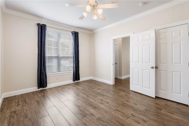 801 Luther St W Unit 307, College Station, TX 77840 - unfurnished bedroom featuring ornamental molding, wood finished floors, baseboards, and a ceiling fan