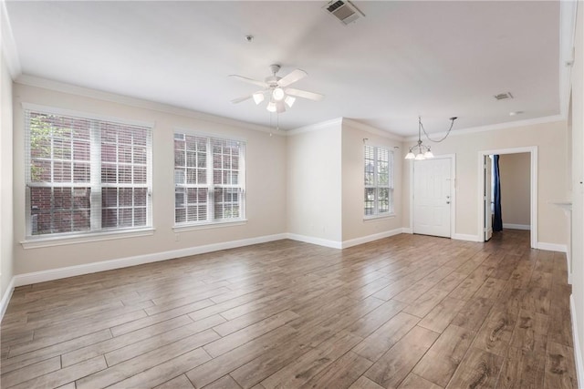801 Luther St W Unit 307, College Station, TX 77840 - unfurnished room featuring a chandelier, wood finished floors, a ceiling fan, baseboards, and crown molding