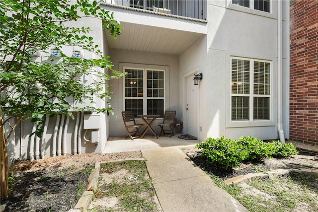 801 Luther St W Unit 307, College Station, TX 77840 - doorway to property featuring stucco siding and brick siding