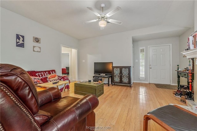 2308 Carnation Ct, College Station, TX 77840 - living room featuring a ceiling fan, light wood-type flooring, and baseboards