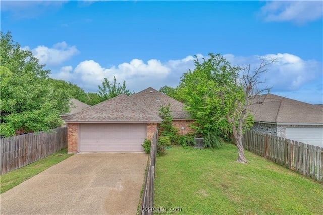 2308 Carnation Ct, College Station, TX 77840 - view of front of house with brick siding, a shingled roof, concrete driveway, and a garage