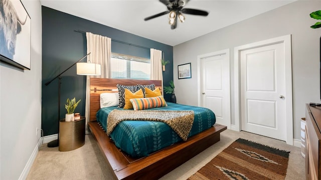 301 W 31st St Unit 103, Bryan, TX 77803 - carpeted bedroom with baseboards and ceiling fan