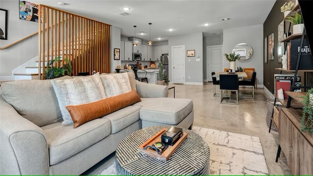 301 W 31st St Unit 103, Bryan, TX 77803 - living area featuring finished concrete floors, visible vents, recessed lighting, stairs, and baseboards