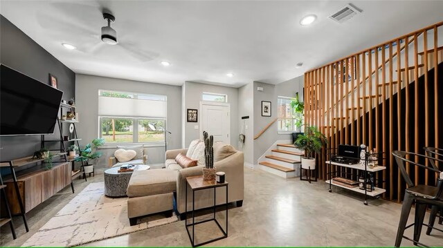 301 W 31st St Unit 103, Bryan, TX 77803 - living room featuring recessed lighting, a ceiling fan, stairs, visible vents, and finished concrete floors