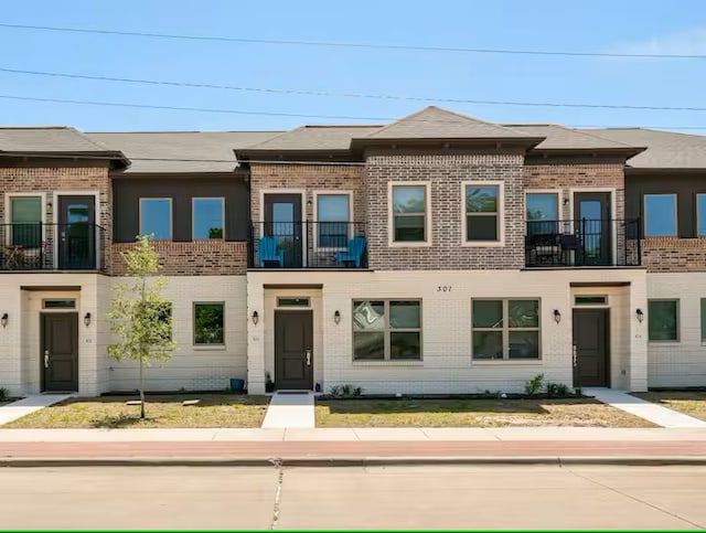 301 W 31st St Unit 103, Bryan, TX 77803 - townhome / multi-family property featuring brick siding