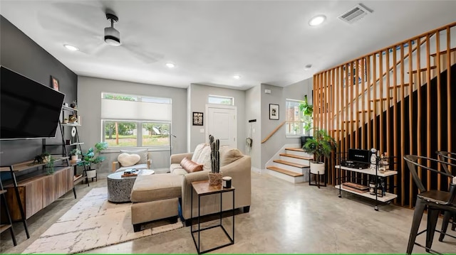 301 W 31st St Unit 103, Bryan, TX 77803 - living area featuring concrete floors, visible vents, a ceiling fan, stairway, and recessed lighting