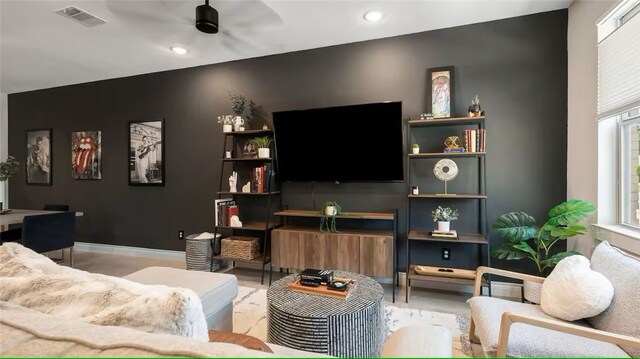301 W 31st St Unit 103, Bryan, TX 77803 - living area featuring recessed lighting, visible vents, a ceiling fan, and an accent wall